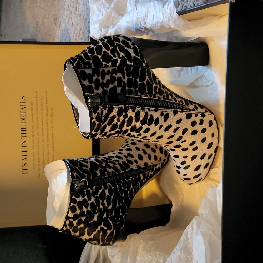 Ann Taylor Women's real leather high heeled ankle booties. Sexy animal print